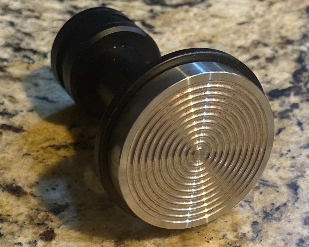 photo of the IKAPE V5 Impact tamper on its side showing the ridged base. 